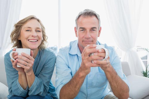 Older couple enjoying the warmth of their home with a reliable R.F. Ohl heating system